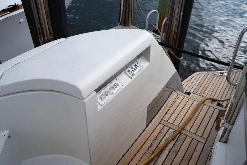 Chopin Yacht Photos Pics 2007 Pershing 62' yacht deck with control panel and wooden flooring.