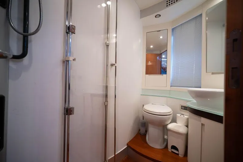 Chopin Yacht Photos Pics Luxurious bathroom in 2007 Pershing 62' yacht with modern fixtures and glass shower.