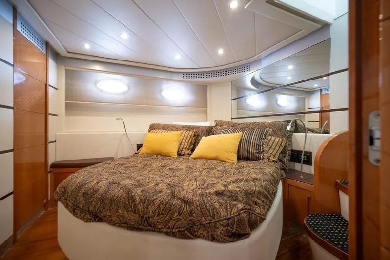 Chopin Yacht Photos Pics Luxurious bedroom interior of 2007 Pershing 62' yacht with elegant bedding and modern design.
