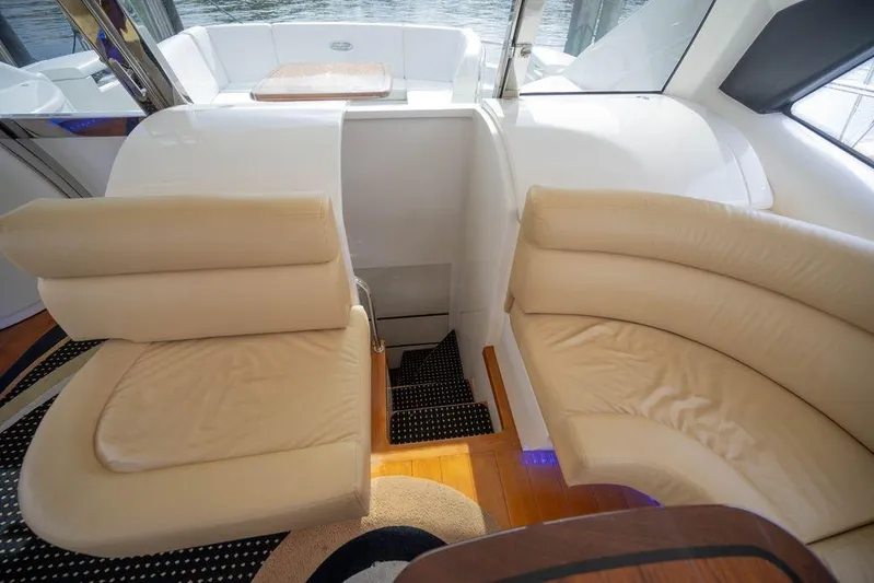 Chopin Yacht Photos Pics Luxurious interior seating on a 2007 Pershing 62' yacht with beige leather upholstery.