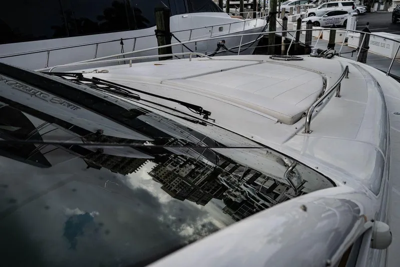 Chopin Yacht Photos Pics 2007 Pershing 62' yacht deck with cityscape reflection on windshield.