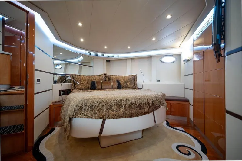 Chopin Yacht Photos Pics Luxurious bedroom interior of 2007 Pershing 62' yacht with elegant decor and ambient lighting.