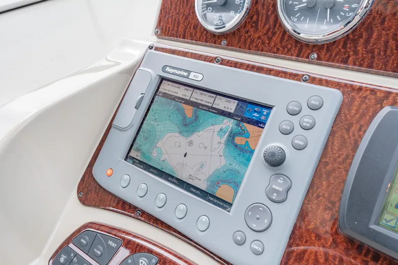 Beau Dacious Yacht Photos Pics Navigation system on 2007 Sea Ray 310 Sundancer boat dashboard with map display.