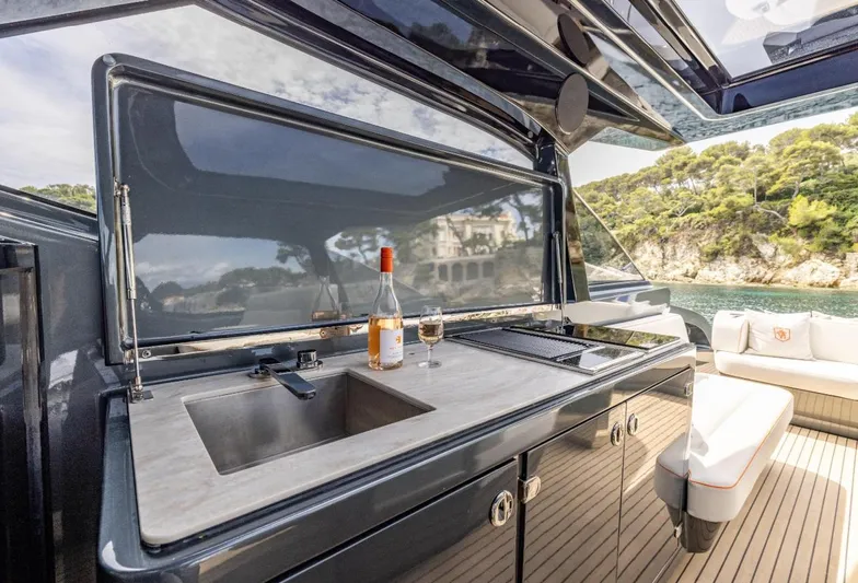  Yacht Photos Pics Luxury outdoor kitchen on 2026 Bekkers Yachts Azur 45, featuring sink and wine setup.