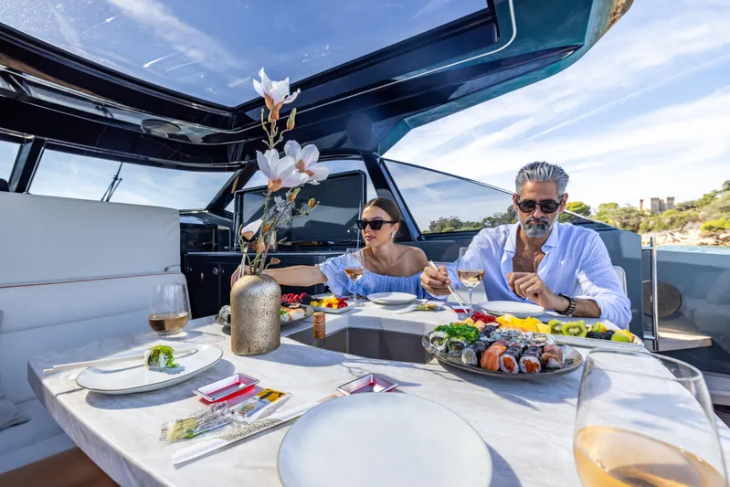  Yacht Photos Pics Couple dining on Bekkers Yachts Azur 45, 2026 model, enjoying a luxurious meal.