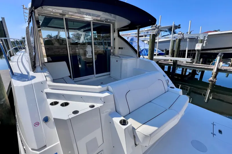  Yacht Photos Pics 2018 Cruisers Yachts 41 Cantius docked, featuring spacious seating and sleek design.