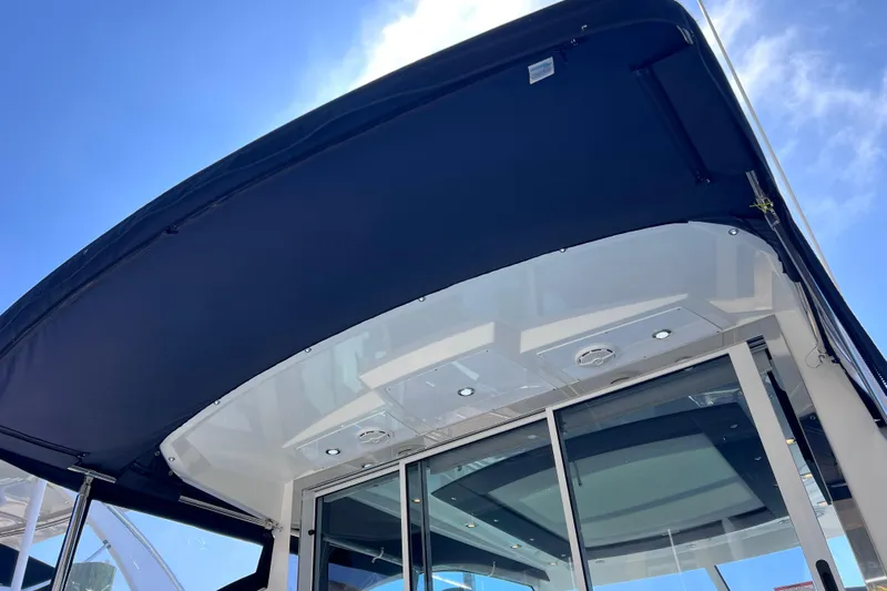  Yacht Photos Pics 2018 Cruisers Yachts 41 Cantius, featuring sleek design and modern amenities under a clear blue sky.