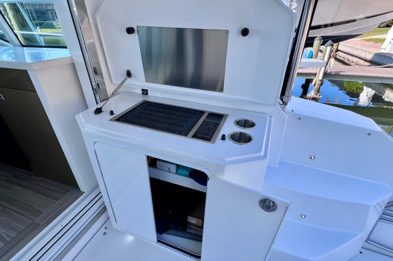  Yacht Photos Pics Outdoor kitchen on 2018 Cruisers Yachts 41 Cantius with grill and storage.