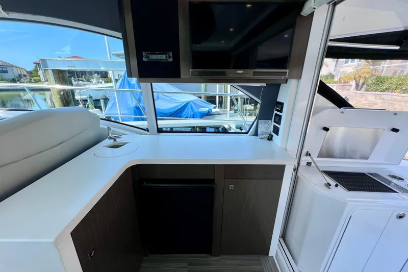  Yacht Photos Pics Interior of 2018 Cruisers Yachts 41 Cantius with kitchenette and window view.