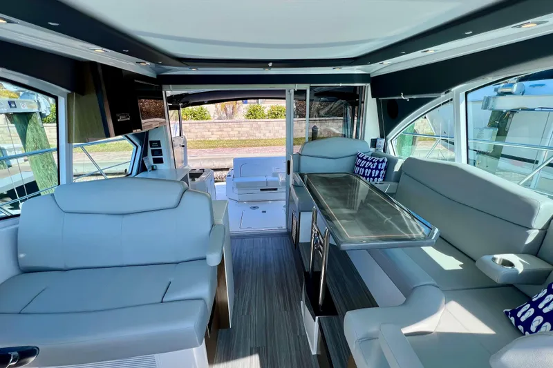 Yacht Photos Pics Luxurious interior of 2018 Cruisers Yachts 41 Cantius with modern seating and dining area.