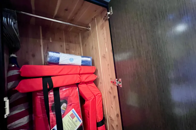  Yacht Photos Pics Storage cabinet on 2018 Cruisers Yachts 41 Cantius with life jackets and safety equipment.