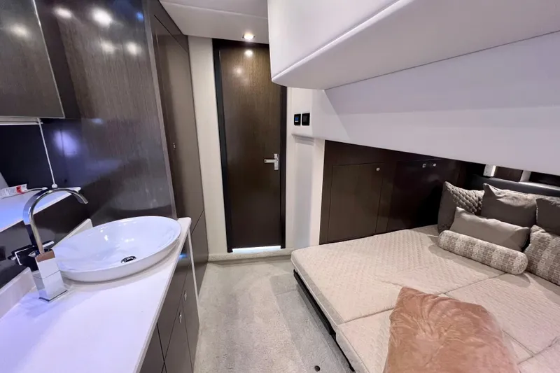  Yacht Photos Pics Luxurious interior of 2018 Cruisers Yachts 41 Cantius with modern sink and cozy bedding.