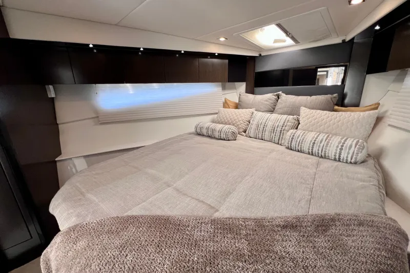  Yacht Photos Pics Luxurious bedroom interior of 2018 Cruisers Yachts 41 Cantius with plush bedding and modern design.