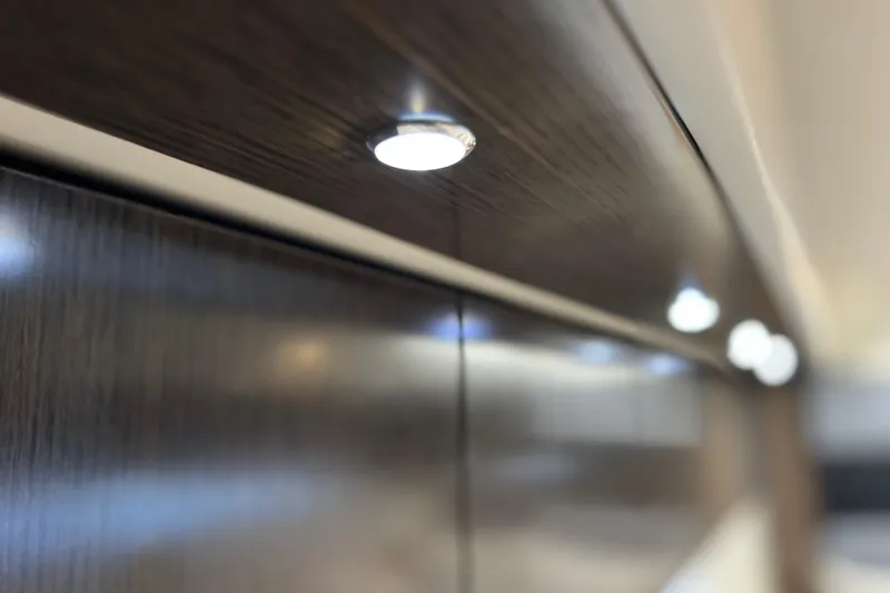  Yacht Photos Pics LED lighting on 2018 Cruisers Yachts 41 Cantius interior, highlighting sleek wood finish.