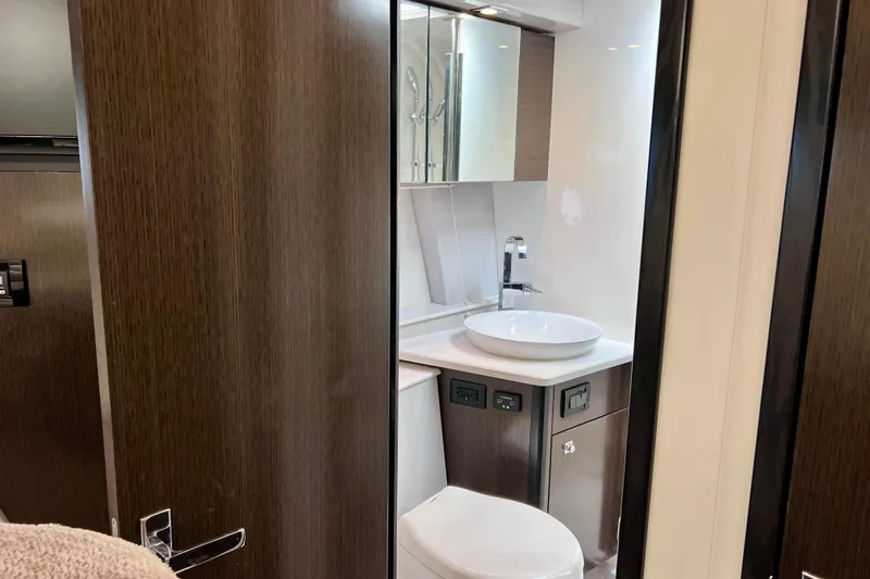  Yacht Photos Pics Luxurious bathroom interior of 2018 Cruisers Yachts 41 Cantius, featuring modern fixtures and wood accents.