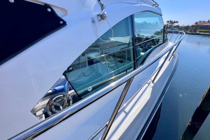  Yacht Photos Pics 2018 Cruisers Yachts 41 Cantius, sleek design, docked on calm water.