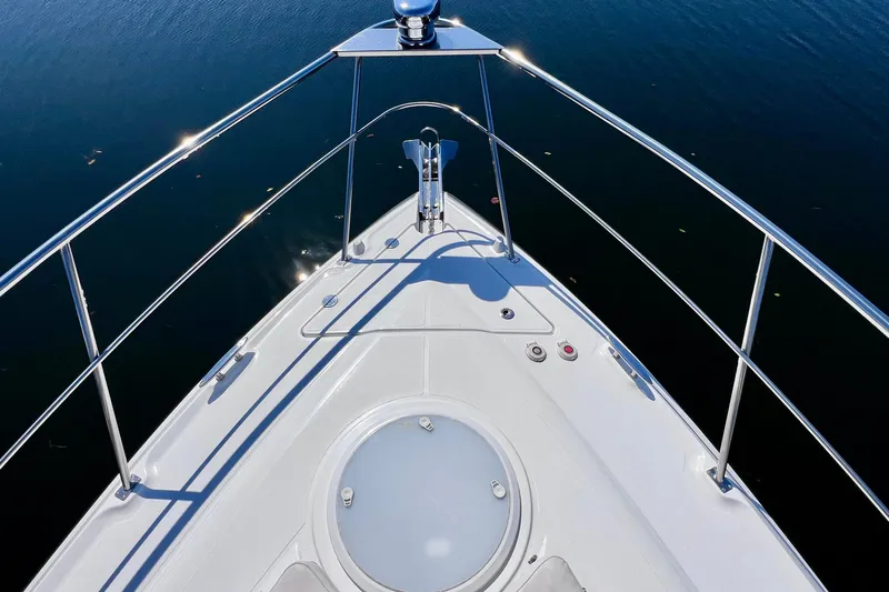  Yacht Photos Pics Bow view of 2018 Cruisers Yachts 41 Cantius on calm water.