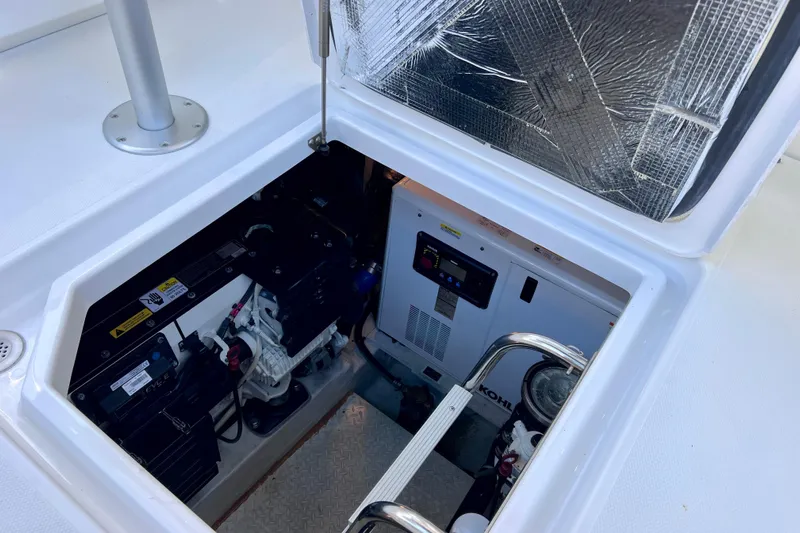  Yacht Photos Pics Engine compartment of 2018 Cruisers Yachts 41 Cantius, showcasing generator and equipment.