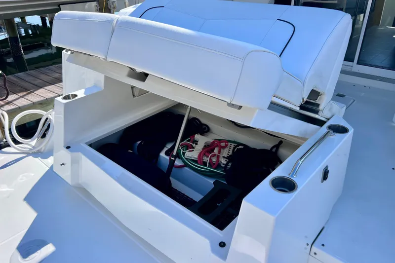  Yacht Photos Pics 2018 Cruisers Yachts 41 Cantius storage compartment with open seat and marine accessories.