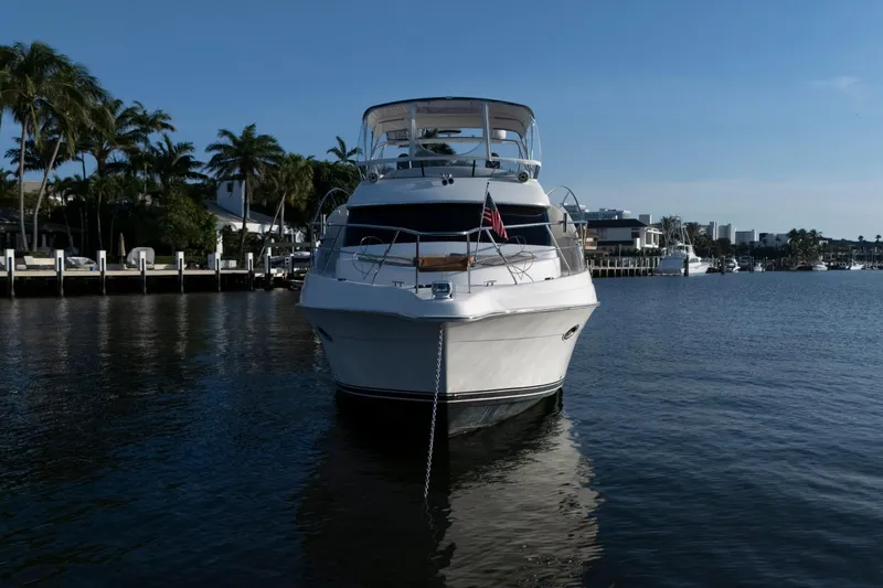 Good Medicine Yacht Photos Pics 2004 Silverton 43 Motor Yacht docked in a serene marina setting.