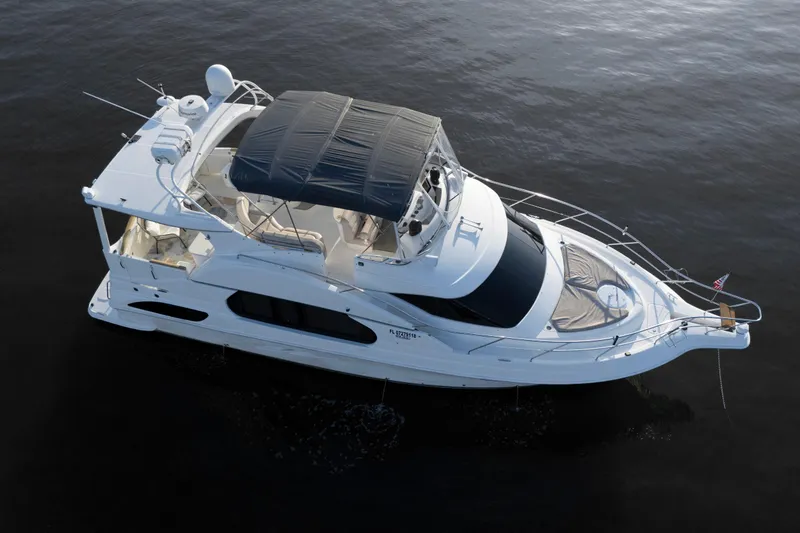 Good Medicine Yacht Photos Pics 2004 Silverton 43 Motor Yacht on calm water, aerial view.