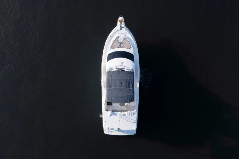 Good Medicine Yacht Photos Pics Top view of a 2004 Silverton 43 Motor Yacht on dark water.
