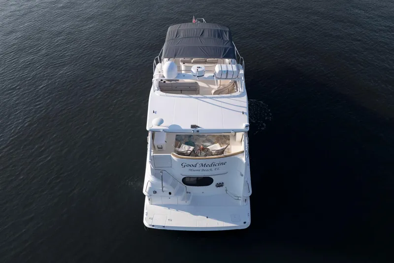 Good Medicine Yacht Photos Pics Aerial view of 2004 Silverton 43 Motor Yacht on calm water.