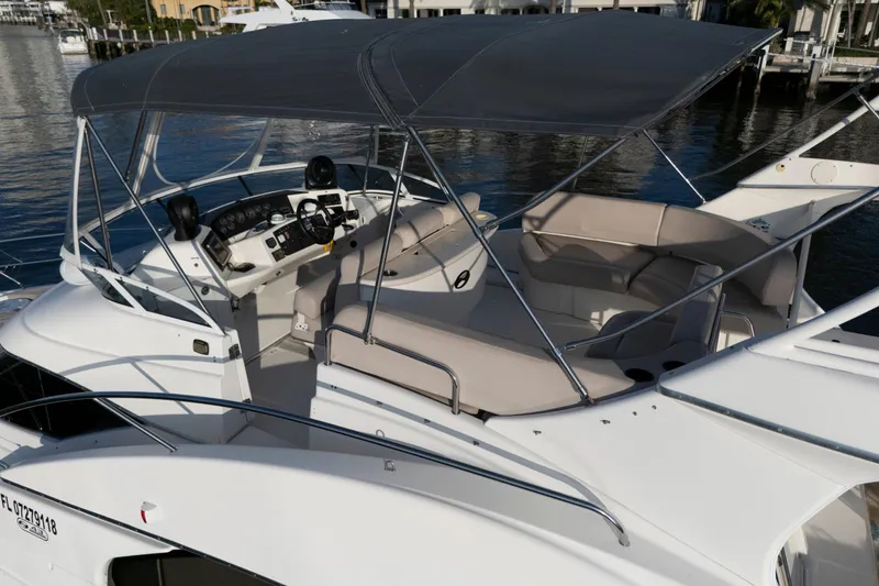 Good Medicine Yacht Photos Pics 2004 Silverton 43 Motor Yacht with spacious deck and canopy, docked at marina.