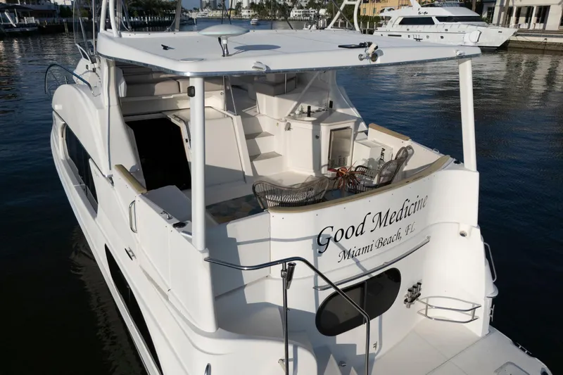 Good Medicine Yacht Photos Pics 2004 Silverton 43 Motor Yacht docked, rear view, named "Good Medicine," Miami Beach, FL.