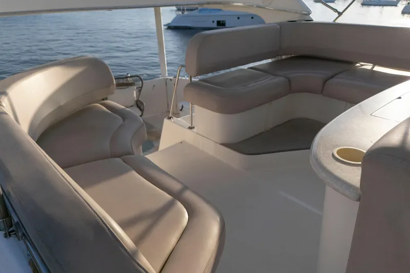 Good Medicine Yacht Photos Pics 2004 Silverton 43 Motor Yacht interior with beige seating and ocean view.