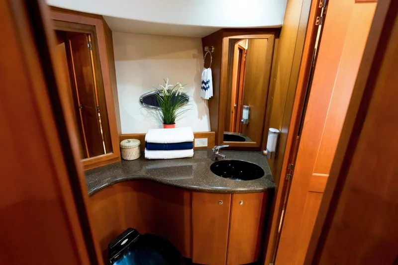Good Medicine Yacht Photos Pics Luxurious bathroom in 2004 Silverton 43 Motor Yacht with elegant wood cabinetry.