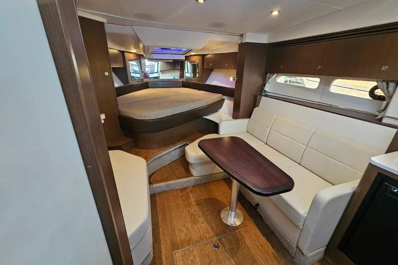 Levon II Yacht Photos Pics Luxurious interior of 2017 Sea Ray Sundancer 350 Coupe with elegant seating and cozy bed.