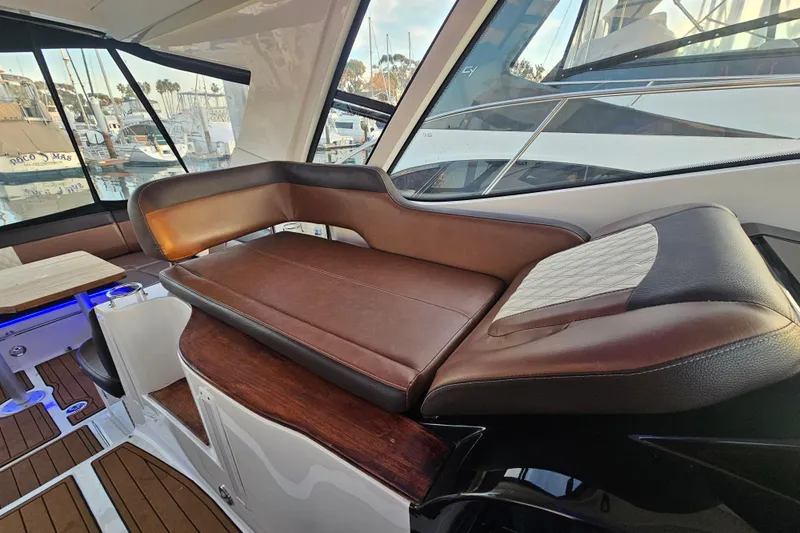 Levon II Yacht Photos Pics Luxurious interior of 2017 Sea Ray Sundancer 350 Coupe with leather seating and marina view.