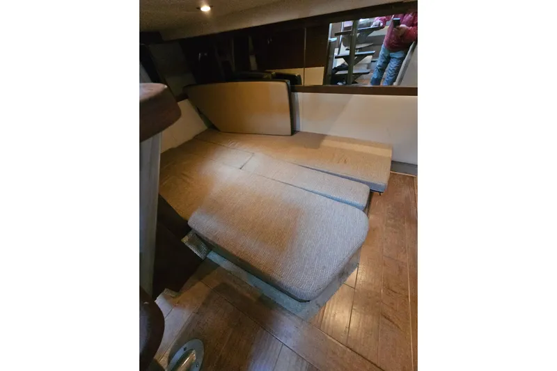 Levon II Yacht Photos Pics 2017 Sea Ray Sundancer 350 Coupe interior with beige seating and wooden flooring.