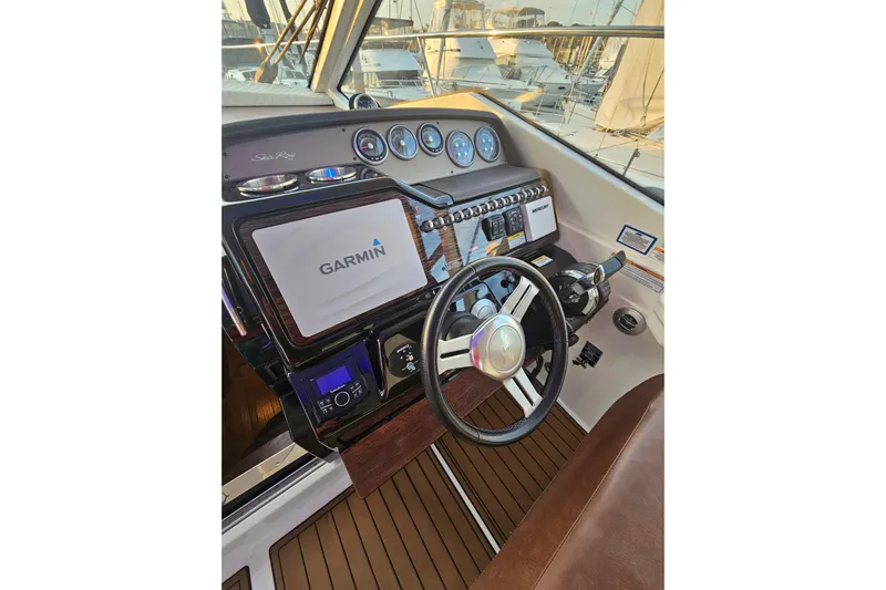 Levon II Yacht Photos Pics 2017 Sea Ray Sundancer 350 Coupe helm with Garmin navigation system and modern controls.