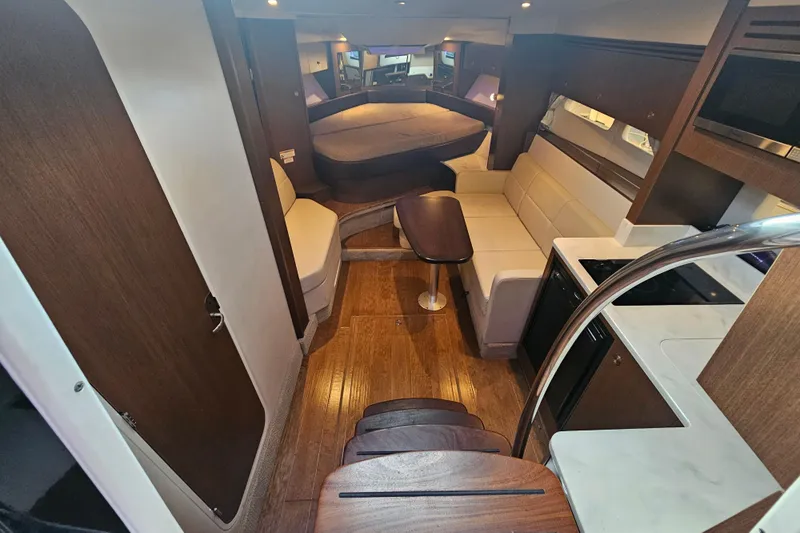 Levon II Yacht Photos Pics Interior of 2017 Sea Ray Sundancer 350 Coupe, featuring elegant wood finishes and modern amenities.