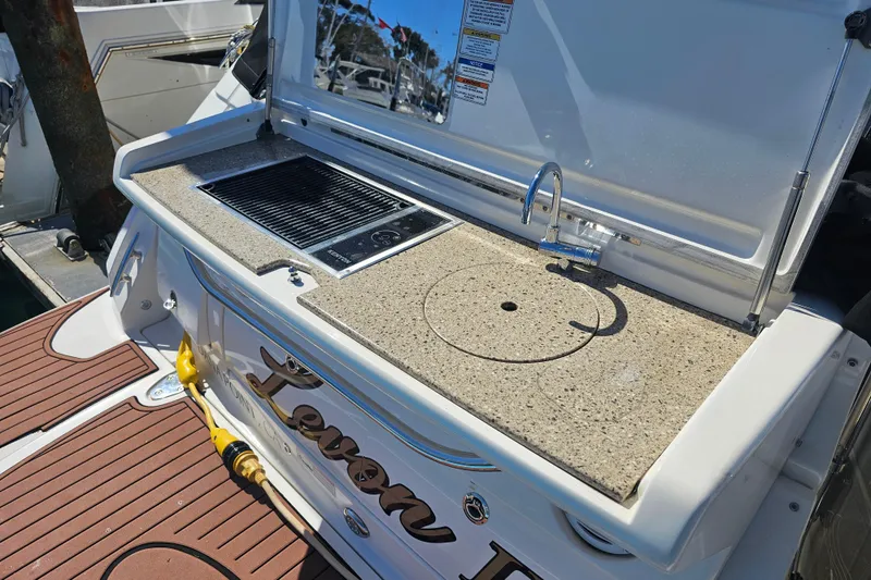 Levon II Yacht Photos Pics Outdoor kitchen on 2017 Sea Ray Sundancer 350 Coupe yacht with sink and grill.