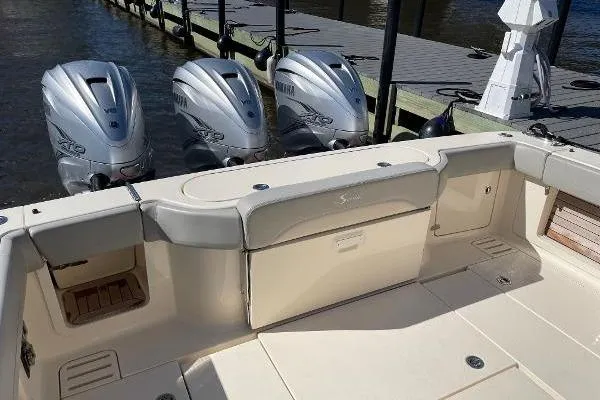  Yacht Photos Pics 2019 Scout 380 LXF boat with triple outboard engines docked at marina.