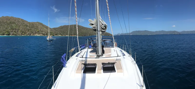 Avalon Sunset Yacht Photos Pics Sailing on a 2016 Hanse 505 yacht in clear blue waters with scenic mountain views.