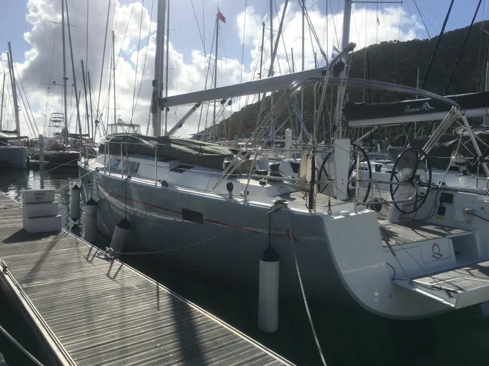 Avalon Sunset Yacht Photos Pics Sailing yacht Hanse 505, 2016 model, docked at marina under cloudy sky.