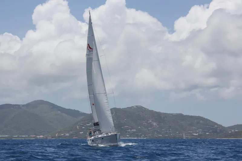 Avalon Sunset Yacht Photos Pics Sailing yacht Hanse 505 (2016) on open sea with mountainous backdrop.