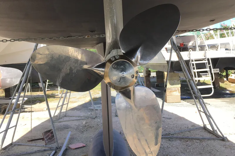 Avalon Sunset Yacht Photos Pics Propeller of 2016 Hanse 505 yacht on dry dock, surrounded by maintenance equipment.