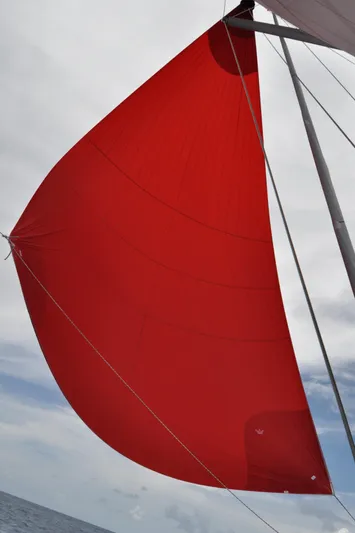 Avalon Sunset Yacht Photos Pics Red sail on a 2016 Hanse 505 yacht against a cloudy sky.