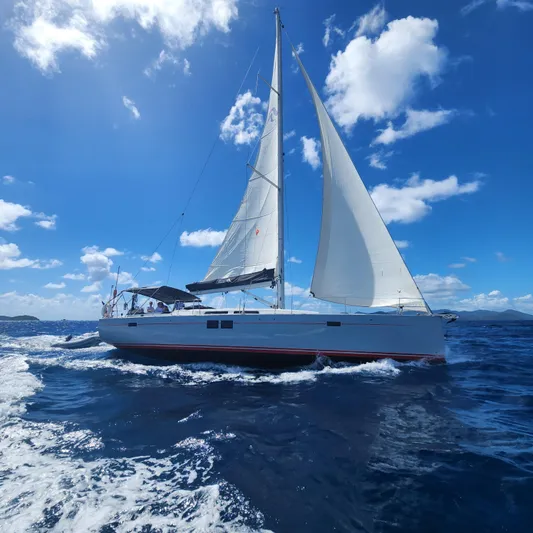 Avalon Sunset Yacht Photos Pics Sailing yacht Hanse 505, 2016 model, cruising on open sea under clear blue sky.