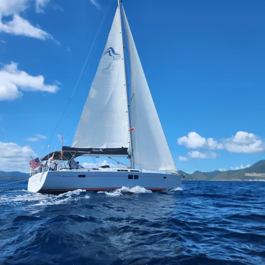 Avalon Sunset Yacht Photos Pics 2016 Hanse 505 sailboat cruising on open sea under clear blue sky.