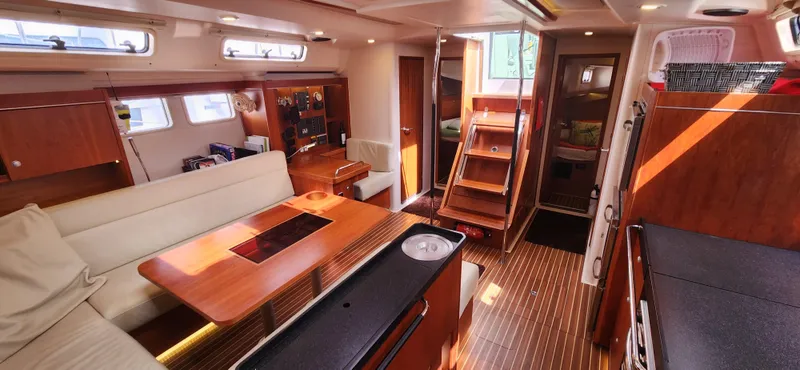 Avalon Sunset Yacht Photos Pics Interior of 2016 Hanse 505 yacht, featuring elegant wood finishes and modern design.