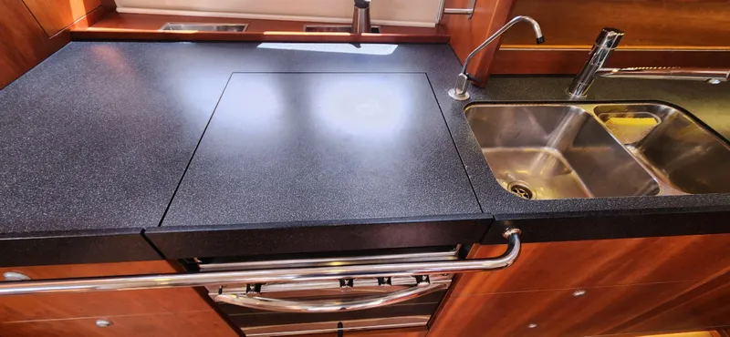 Avalon Sunset Yacht Photos Pics Modern kitchen in 2016 Hanse 505 yacht with sleek countertop and dual sink.