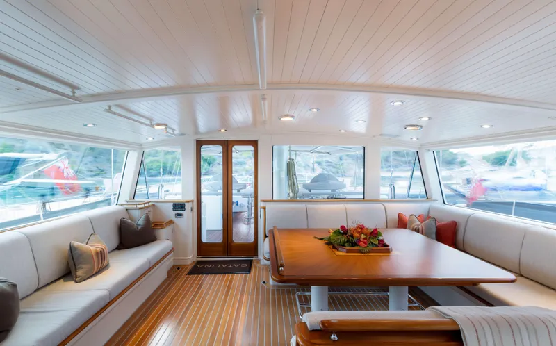 Catalina Yacht Photos Pics Luxurious interior of 2001 Vitters Cruising Ketch with elegant seating and wooden table.