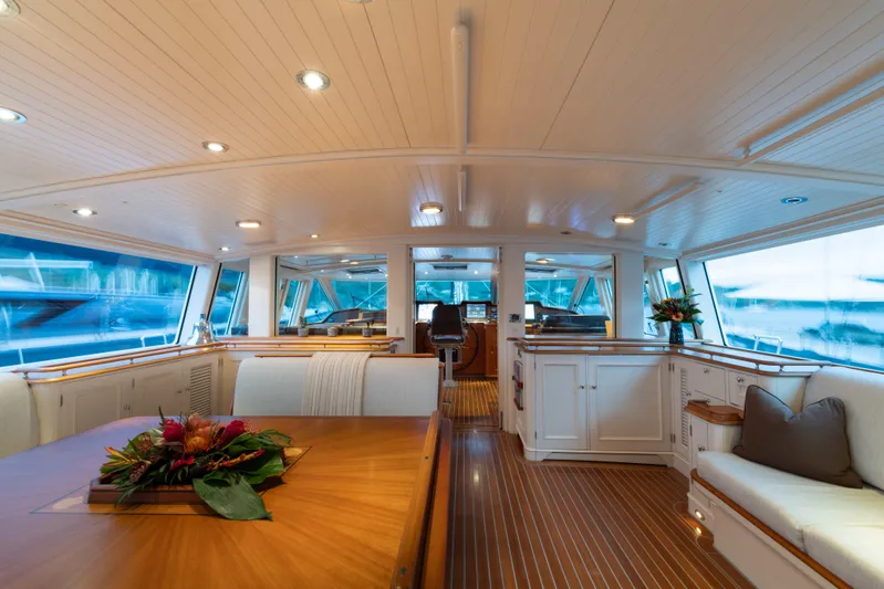 Catalina Yacht Photos Pics Luxurious interior of 2001 Vitters Cruising Ketch with elegant wood finishes and panoramic windows.