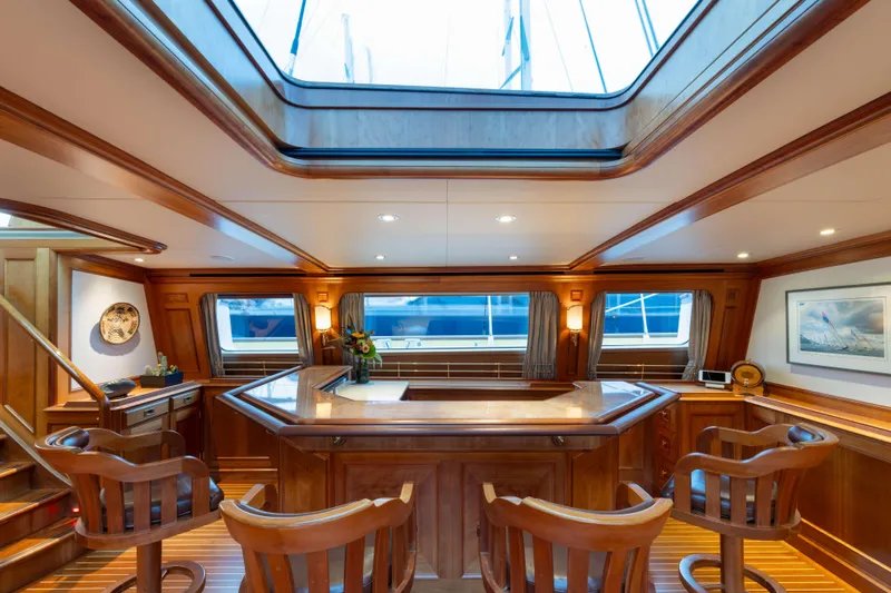 Catalina Yacht Photos Pics Luxurious interior of 2001 Vitters Cruising Ketch with elegant wood finishes and skylight.